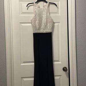 Black/White sequin dress. Long and form fitting.